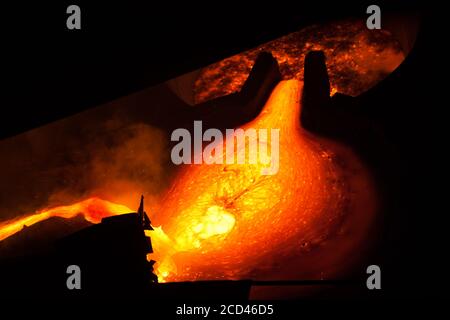 Metallurgy factory workshop. Melting process. Metallurgical bucket with liquid metal. Close-up photo. Stock Photo