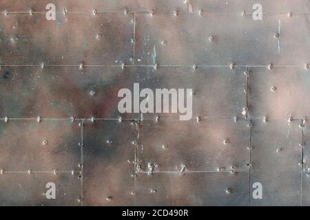 Armored wall of metal plates. Background Stock Photo