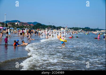 People enjoy the view of Beidai River as people flock to Beidaihe Scenic Spot as summer resort in Qinhuangdao city, north China's Hebei province, 24 J Stock Photo