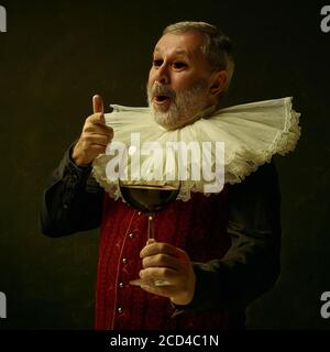 Medieval person, senior man posing wearing old-fashioned clothes posing ...