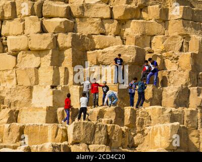 Climbing the Great Pyramid Stock Photo