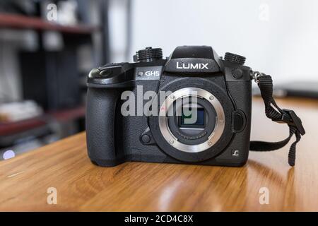 Panasonic Lumix GH5 body only on a wooden table. Amazing mirrorless camera that produces C 4K 10 bits All-intra video. Micro four third sensor. Stock Photo