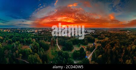 Panoramic air view of hot colorful air ballons prepare for an early morning takeoff from park in small european city, Kiev region, Ukraine Stock Photo