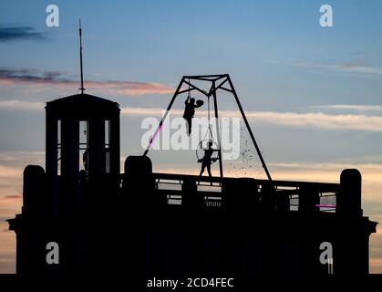 Prague, Czech Republic. 25th Aug, 2020. Acrobats perform during the filming of Andersen's fairy tale The Shepherdess and the Chimney Sweep, on August 25, 2020, on the roofs of the Lucerna Palace in Prague, Czech Republic. Credit: Roman Vondrous/CTK Photo/Alamy Live News Stock Photo