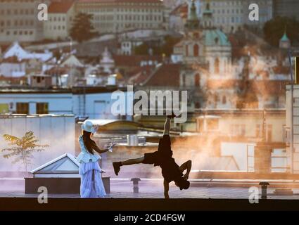 Prague, Czech Republic. 25th Aug, 2020. Acrobats perform during the filming of Andersen's fairy tale The Shepherdess and the Chimney Sweep, on August 25, 2020, on the roofs of the Lucerna Palace in Prague, Czech Republic. Credit: Roman Vondrous/CTK Photo/Alamy Live News Stock Photo