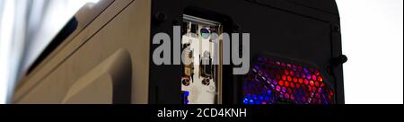 Desktop computer black case with led rgb cooling fan and ports low angle view Stock Photo