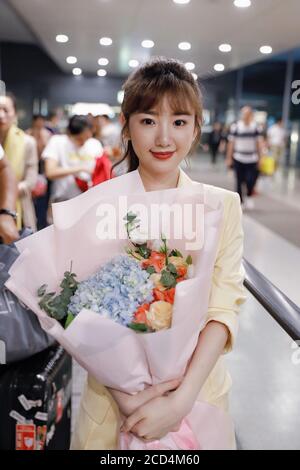 Chinese actress Mao Xiaotong, also known as Rachel Momo, shows up with girly smile and receives from fans at an airport in Shanghai, China, 8 July 202 Stock Photo