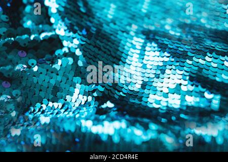 AI aqua blue trendy color of year 2021 sequin fabric texture. Shiny sparkling background. Clothing piece of glitter metallic for a glamorous party, ce Stock Photo