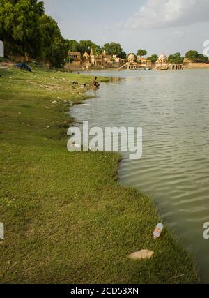 polluted lake plastic bottles and garbage at the lake. plastic pollution. environment pollution Stock Photo