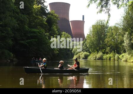 People rowing in hired canoes on the River Severn at Ironbridge in Shropshire Uk Stock Photo