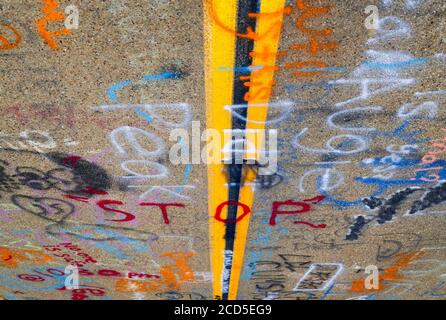 Road surface vandalized with graffiti Stock Photo