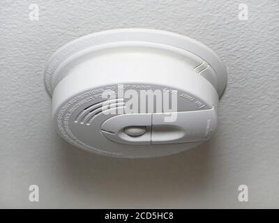 Close up of a ceiling mount white smoke detector used in homes. Stock Photo