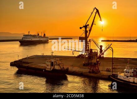 Ship from Piraeus arriving at the port of Heraklion, early in the morning.  Crete, Greece. Stock Photo
