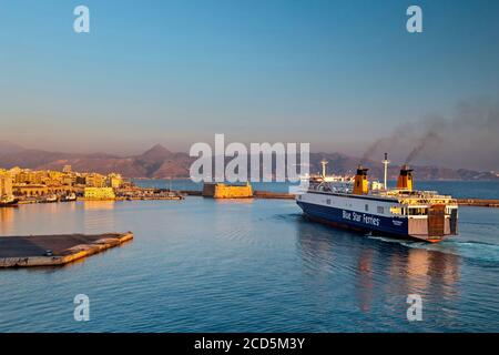 Ship from Piraeus arriving at the por of Heraklion, early in the morning.  Crete, Greece. Stock Photo