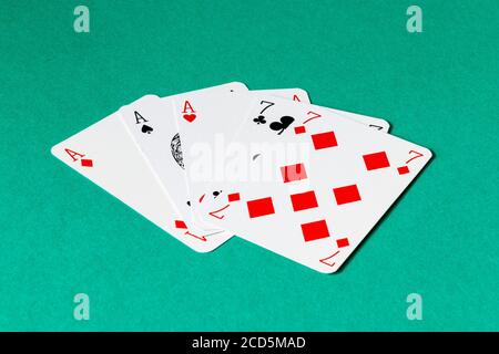 A full house of aces and sevens in a game of poker Stock Photo