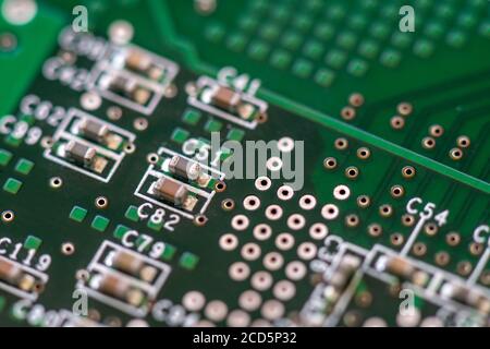Close-up of a SMD capacitors on a printed circuit board. Electronic components. Stock Photo