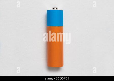 Generic alkaline battery on white background. Copy space. Stock Photo