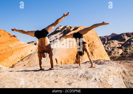 two naked men naked handstand Stock Photo - Alamy