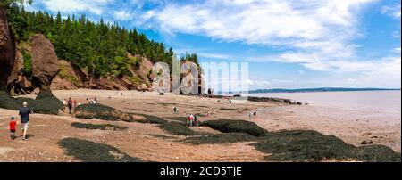 Tourists enjoying Hopewell Rocks provincial park on Bay of Fundy, New Brunswick, Canada Stock Photo
