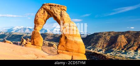 View of Delicate Arch with La Sal Mountains in background, Arches National Park, Moab, Utah, USA Stock Photo
