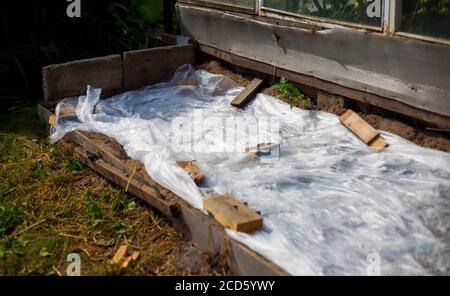 Greenhouses made of polymer film. Early spring Stock Photo