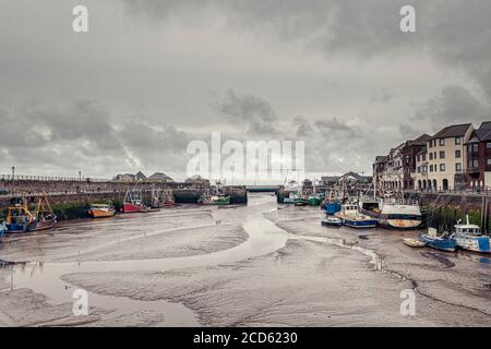 Fishing boats in the harbour at Maryport at low tide Stock Photo