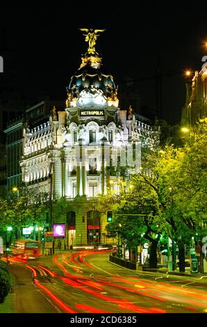 Metropolis Building at night and light trails on street, Madrid, Spain Stock Photo