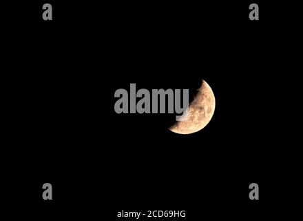 close up of half moon in a dark night sky Stock Photo