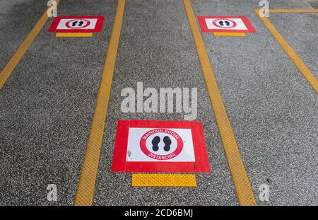 Hong Kong,China:26 Aug,2020.  Social distancing markers on the pavement at the bus top at The Hong Kong University of Science and Technology, Clearwat Stock Photo