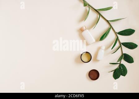 Natural cosmetic. Bottles of creams on a beige background. Copying space. Flat lay. Eco-friendly product for body and face care Stock Photo