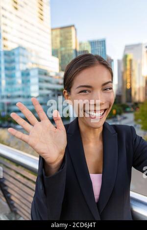 Business woman video call on phone Asian professional businesswoman taking selfie photo using smartphone app on smartphone for social media Stock Photo