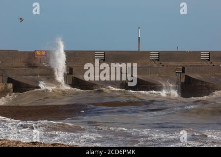 The rough seas were breaching the Marina Harbour wall caused by the remnants from Storm Francis Stock Photo