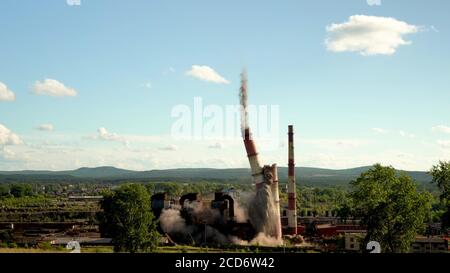 The collapse of an industrial chimney. Explosion of an old chimney of ...