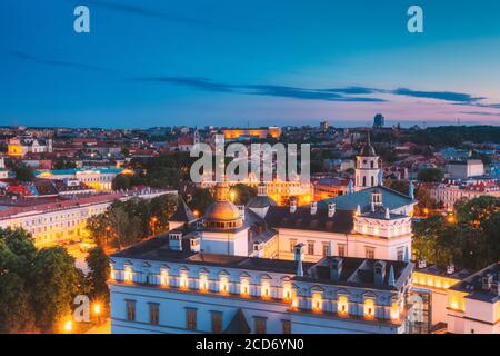 Vilnius, Lithuania, Eastern Europe. Aerial View Of Historic Center Cityscape In Blue Hour After Sunset. Old Town In Night Illuminations. UNESCO Stock Photo