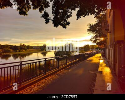 Dresden, Germany. Panoramic cityscape image of Dresden, Germany with reflection of the city in the Elbe river, during sunset. Stock Photo
