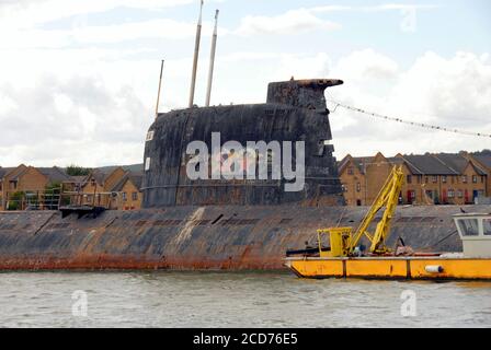 Hammer and siclke and five-pointed star, and variour graffiti, on side of former Russian submarine U-475 Black Widow on the river Medway Kent, England Stock Photo