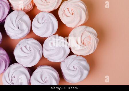 Marshmallows on pastel yellow background. Flat lay. Top view Stock Photo