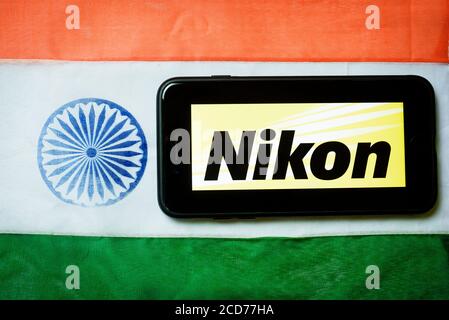 Kolkata, India 27-Aug-2020 : Concept of Apple launching mobile service in India. Apple logo in mobile phone screen with Indian flag background and cop Stock Photo