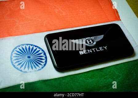 Kolkata, India 27-Aug-2020 : Concept of Apple launching mobile service in India. Apple logo in mobile phone screen with Indian flag background and cop Stock Photo