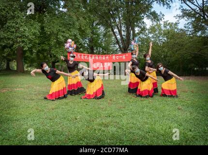 Chinese American dancers from the Wenzhou America New York troupe celebrate their 5th anniversary with a performance in a park in Queens, New York Stock Photo