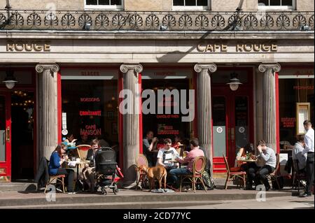 People dining al fresco outside cafe rouge on a street in the city of Edinburgh, Scotland. Stock Photo