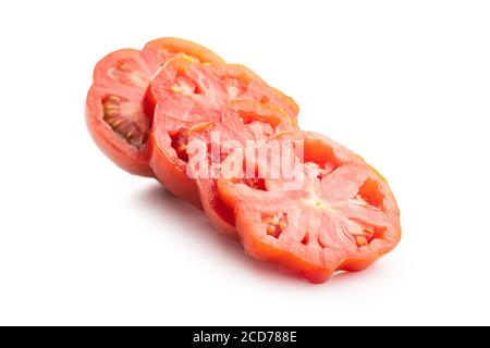 Sliced red beefsteak tomatoes isolated on white backround. Stock Photo