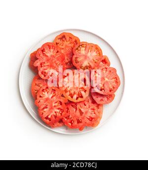 Sliced red beefsteak tomatoes isolated on white backround. Stock Photo