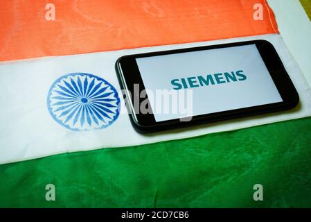 Kolkata, India 27-Aug-2020 : Concept of Apple launching mobile service in India. Apple logo in mobile phone screen with Indian flag background and cop Stock Photo