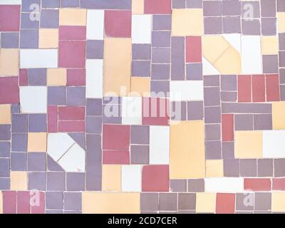 Real antique wall tiles background texture. White, red and yellow geometric pattern. Stock Photo