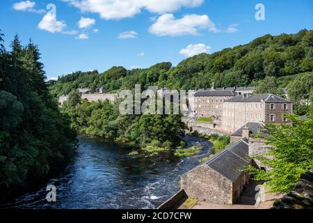 View of New Lanark World Heritage Site from Falls of Clyde footpath - New Lanark, Lanarkshire, Scotland, UK Stock Photo