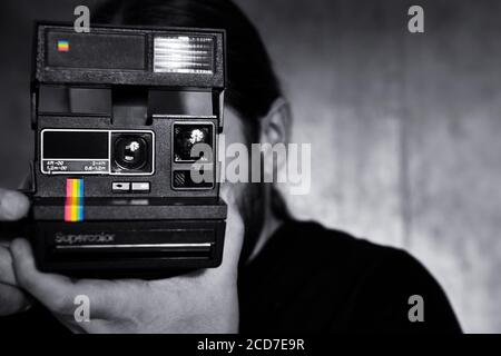 Polaroid photographer Stock Photo