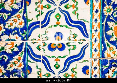 Closeup shot of blue, white and orange colored ornamental ceramic tile Stock Photo