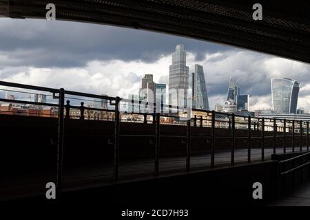 View of skyscrapers in the City of London seen from the Thames Path. Stock Photo