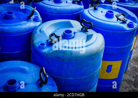 Blue water tank kept in roadside Stock Photo